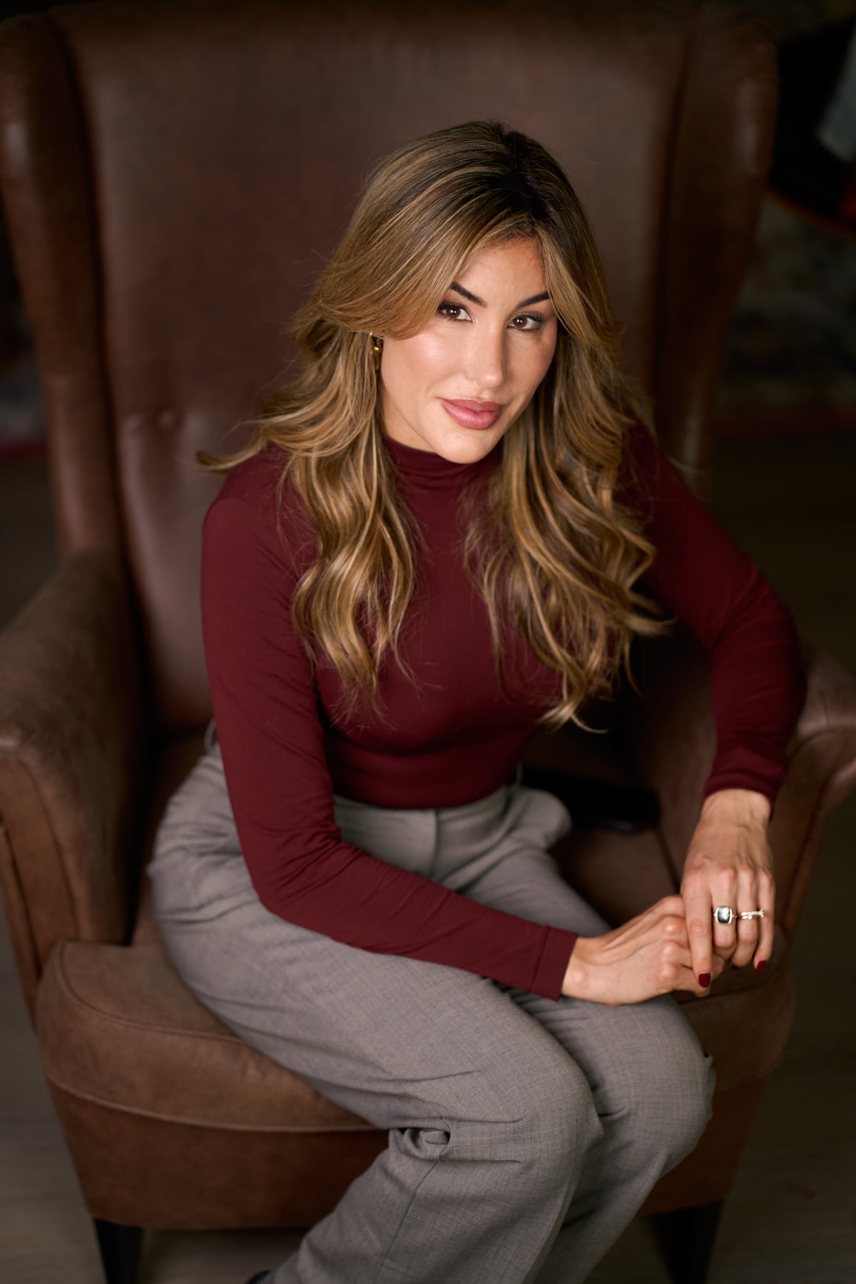 Portrait of a London aesthetic practitioner in medical attire photographed with soft natural light at The Designer's Penthouse for personal branding