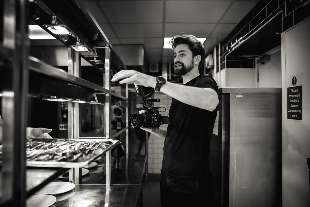 Etienne Morax working with a camera rig in black and white