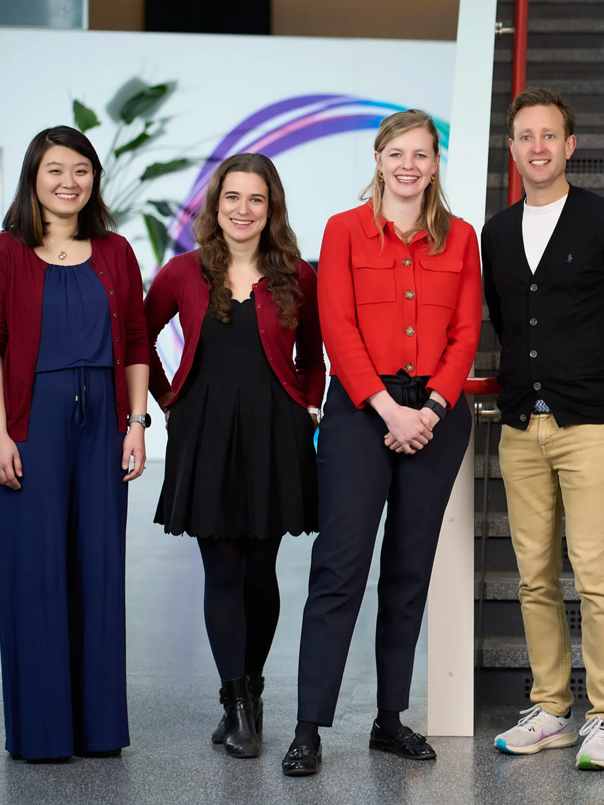 Corporate team portrait — four leaders in their London office