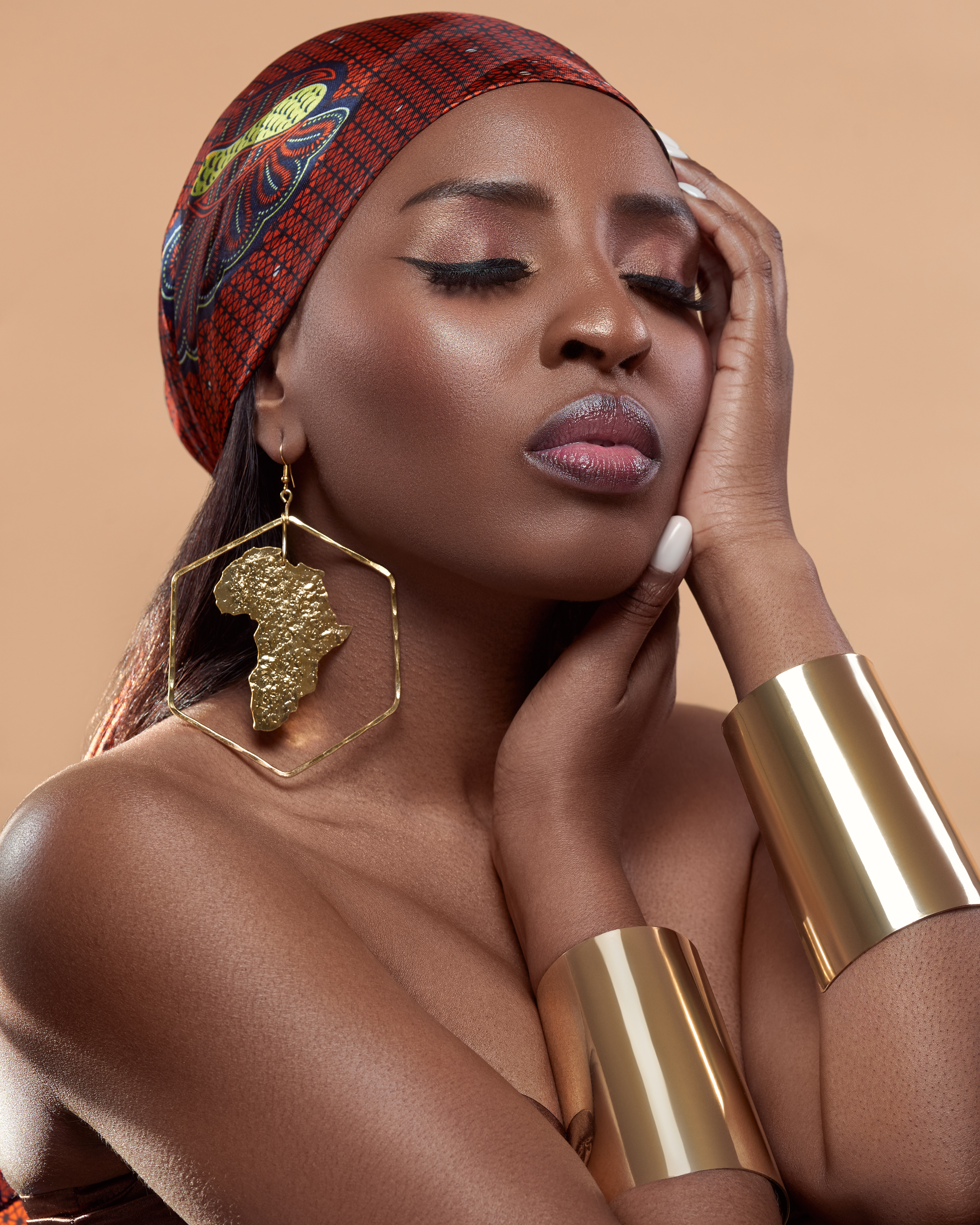 Founder and daughter wearing Jarlia By Jolina fine jewelry, photographed in studio with specialised lighting for dark skin tones and metallic highlights