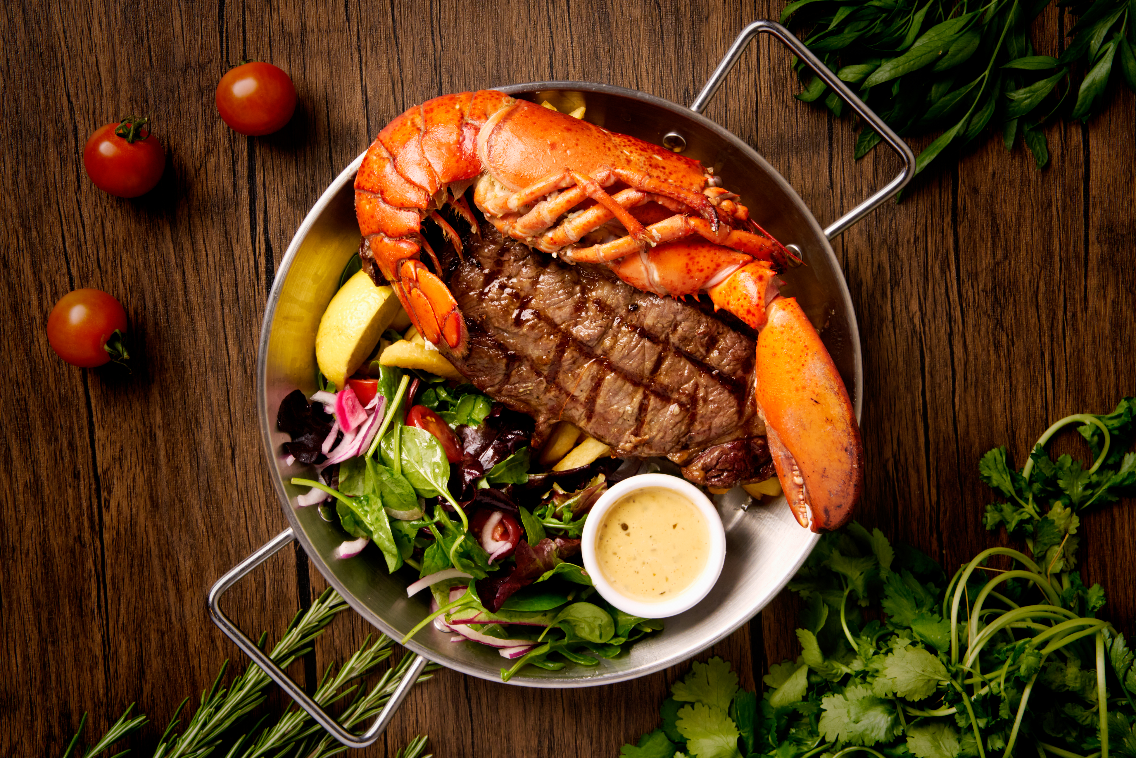 Plated seafood dish photographed for The Shell restaurant menu, lit to evoke Mediterranean coastal light in a London studio setting